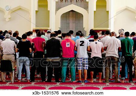 Muslim prayer at a mosque in Madrid, Spain View Large Photo Image Stock Photograph - Muslim prayer at a mosque in Madrid, Spain. Fotosearch