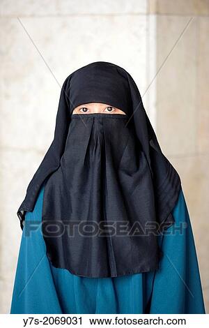 Muslim woman wearing a nikab traditional Islamic veil in Jakarta, Indonesia, South East Asia. View Large Photo Image Stock Image - Muslim woman wearing a nikab traditional Islamic veil in Jakarta, Indonesia, South East Asia.. Fotosearch