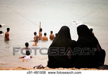 Muslim women on the beach. India View Large Photo Image Stock Photograph - Muslim women on the beach. India. Fotosearch