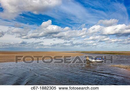 Mussels fisherman returning on River Stiffkey in Blakeney Harbour, Norfolk, September View Large Photo Image Stock Photography - Mussels fisherman returning on River Stiffkey in Blakeney Harbour, Norfolk, September. Fotosearch