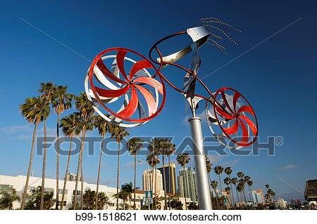 Stock Image - MY BIKE SCULPTURE BY AMOS ROBINSON EMBARCADERO SKYLINE DOWNTOWN SAN DIEGO CALIFORNIA USA. Fotosearch