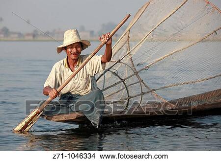 Myanmar, Burma, Inle Lake, fisherman, boat, conical net, View Large Photo Image Picture - Myanmar, Burma, Inle Lake, fisherman, boat, conical net,. Fotosearch