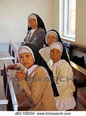 Myanmar Nuns attending Catholic wedding of tribal Kachins at Myitkyina, a largely Kachin community in north Burma near the Chinese border View Large Photo Image Picture - Myanmar Nuns attending Catholic wedding of tribal Kachins at Myitkyina, a largely Kachin community in north Burma near the Chinese border. Fotosearch