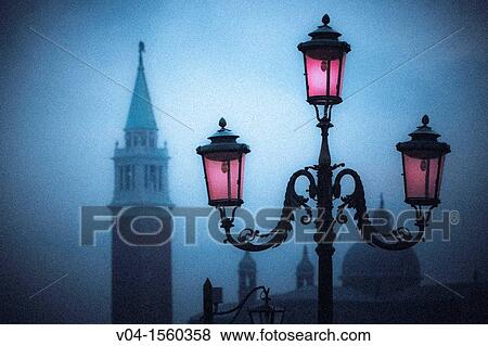 Mystical view of a glowing lantern and the Campanile in Venice, Italy, Europe View Large Photo Image Stock Photo - Mystical view of a glowing lantern and the Campanile in Venice, Italy, Europe. Fotosearch