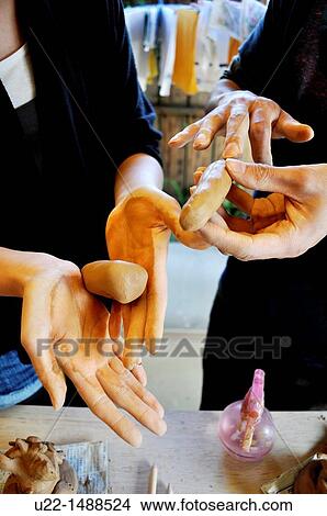 Naha (Japan): shaping terracotta, at Ikutouen pottery lab, in Tsuboya neighborhood View Large Photo Image Picture - Naha (Japan): shaping terracotta, at Ikutouen pottery lab, in Tsuboya neighborhood. Fotosearch