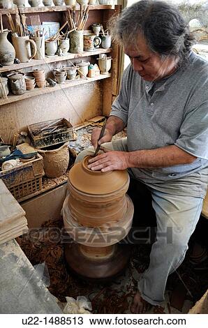 Naha (Japan): shaping terracotta in a pottery lab, in Tsuboya neighborhood View Large Photo Image Stock Image - Naha (Japan): shaping terracotta in a pottery lab, in Tsuboya neighborhood. Fotosearch