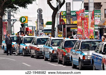 Naha, Okinawa, Japan, long line of taxis along Okiei-dori, on Sunday View Large Photo Image Stock Image - Naha, Okinawa, Japan, long line of taxis along Okiei-dori, on Sunday. Fotosearch