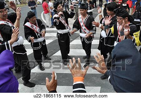 Stock Photography - Naha, Okinawa, Japan, Okinawan men along the Route 58 during the Tug of war Festival, October. Fotosearch