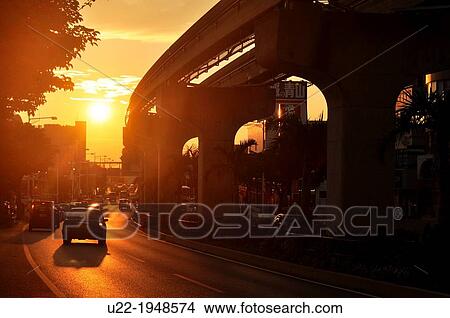 Naha, Okinawa, Japan, sunset by the Urban Monorail-Yui Rail track in Akamine neighborhood View Large Photo Image Picture - Naha, Okinawa, Japan, sunset by the Urban Monorail-Yui Rail track in Akamine neighborhood. Fotosearch