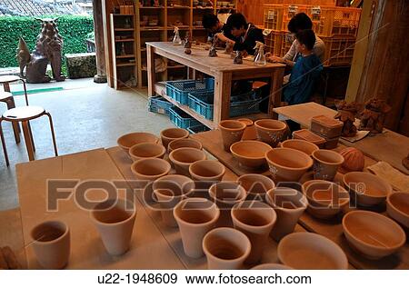 Naha, Okinawa, Japan, tourists shaping terracotta at Ikutouen pottery lab, in Tsuboya neighborhood View Large Photo Image Stock Photo - Naha, Okinawa, Japan, tourists shaping terracotta at Ikutouen pottery lab, in Tsuboya neighborhood. Fotosearch