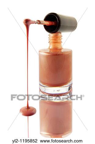 Nail Varnish dripping from a nail varnish brush balanced on a nail varnish bottle Peach colour against white with a reflection View Large Photo Image Stock Image - Nail Varnish dripping from a nail varnish brush balanced on a nail varnish bottle Peach colour against white with a reflection. Fotosearch