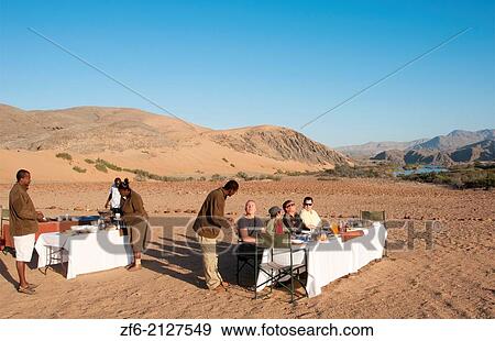 Namibia Africa Northern Desert of Namib Desert border of Angola and Kunene River safari with lunch on river with tent and campers in Hartmann Berge deserted land Hartmann Valley Marienflub, Serra Cafema Resort. View Large Photo Image Stock Photo - Namibia Africa Northern Desert of Namib Desert border of Angola and Kunene River safari with lunch on river with tent and campers in Hartmann Berge deserted land Hartmann Valley Marienflub, Serra Cafema Resort.. Fotosearch