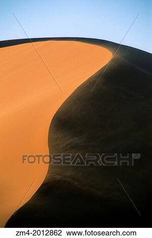 NAMIBIA, NAMIB-NAUKLUFT NATIONAL PARK, SOSSUSVLEI, SAND DUNE WITH WIND BLOWING. View Large Photo Image Stock Image - NAMIBIA, NAMIB-NAUKLUFT NATIONAL PARK, SOSSUSVLEI, SAND DUNE WITH WIND BLOWING.. Fotosearch