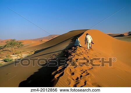 Stock Photograph - NAMIBIA, NAMIB-NAUKLUFT NATIONAL PARK, SOSSUSVLEI, PEOPLE PHOTOGRAPHING SAND DUNES.. Fotosearch