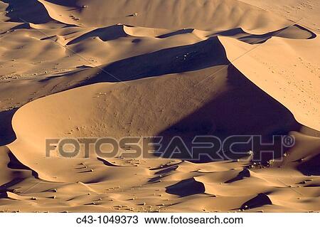 Stock Image - Namibia - Sand dunes in the Namib Desert Namib-Naukluft Park, Namibia. Fotosearch