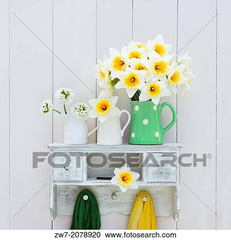Narcissus and Primula flowers in ceramic containers on wooden shelf, still life. View Large Photo Image Stock Image - Narcissus and Primula flowers in ceramic containers on wooden shelf, still life.. Fotosearch