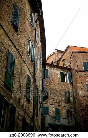 Narrow medieval street in Siena, Italy View Large Photo Image Stock Photograph - Narrow medieval street in Siena, Italy. Fotosearch