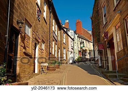 Narrow street of the historic fishing village of Robin Hood's Bay, Near Whitby, North Yorkshire, England. View Large Photo Image Stock Image - Narrow street of the historic fishing village of Robin Hood's Bay, Near Whitby, North Yorkshire, England.. Fotosearch