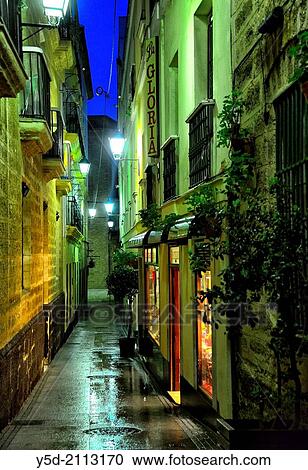 narrow street old town of Cadiz by night, Cadiz, Andalusia, Spain. View Large Photo Image Stock Image - narrow street old town of Cadiz by night, Cadiz, Andalusia, Spain.. Fotosearch