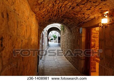 Stock Image - Narrow street, Rab Town on Rab Island, Croatia. Fotosearch