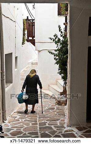 Narrow whitwashed allyway in the Old town of Naxos, Naxos island, Cyclades, Greece View Large Photo Image Stock Image - Narrow whitwashed allyway in the Old town of Naxos, Naxos island, Cyclades, Greece. Fotosearch