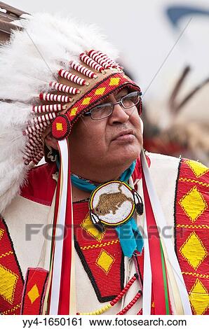 Native male elder in traditional regalia, T? suu Tina Pow wow, Bragg Creek, Alberta, Canada View Large Photo Image Stock Image - Native male elder in traditional regalia, T? suu Tina Pow wow, Bragg Creek, Alberta, Canada. Fotosearch