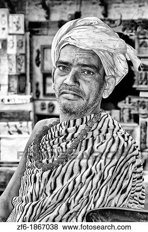 Stock Photo - Native man in colorful dress in Bhaktapur town near Kathmandu Nepal. Fotosearch