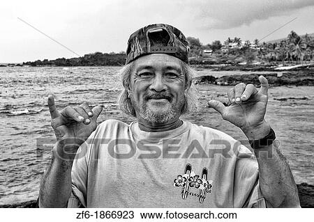 Native man making Hawaiian sign at remote village of Milolii South of Big Island Hawaii View Large Photo Image Stock Image - Native man making Hawaiian sign at remote village of Milolii South of Big Island Hawaii. Fotosearch