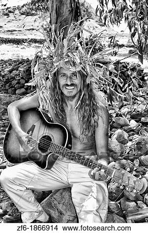 Native playing guitar Easter Island during Tapati Festival Rapa Nui View Large Photo Image Picture - Native playing guitar Easter Island during Tapati Festival Rapa Nui. Fotosearch