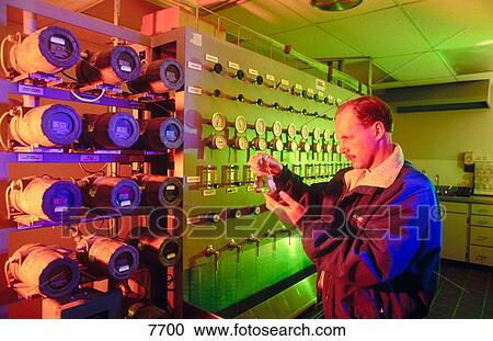 Natural gas fired power cogeneration plant. Worker taking water samples at testing laboratory View Large Photo Image Stock Image - Natural gas fired power cogeneration plant. Worker taking water samples at testing laboratory. Fotosearch