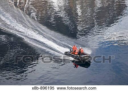 Stock Photography - Natural history staff from the Lindblad Expedition ship National Geographic Endeavour in LeMaire Channel on the western side of the Antarctic Peninsula in the summer months.. Fotosearch