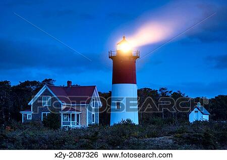 Nauset Light shines at night, Cape Cod National Seashore, Eastham, Cape Cod, MA, USA. View Large Photo Image Stock Photograph - Nauset Light shines at night, Cape Cod National Seashore, Eastham, Cape Cod, MA, USA.. Fotosearch