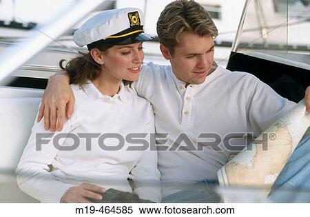 nautical couple on a boat View Large Photo Image Stock Photography - nautical couple on a boat. Fotosearch