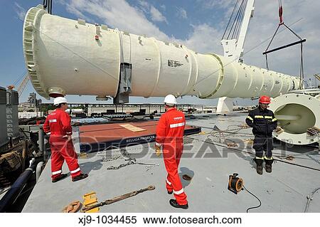 Stock Photography - Naval operations of unloading and loading of petroleum components exceptional size. Fotosearch