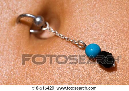 Navel piercing, close-up View Large Photo Image Stock Photo - Navel piercing, close-up. Fotosearch