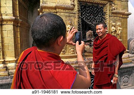 Nepal, City of Kathmandu, buddhist temple of Swayambhunath (or monkeys temple) built on top of a hill, monk and monkey View Large Photo Image Stock Image - Nepal, City of Kathmandu, buddhist temple of Swayambhunath (or monkeys temple) built on top of a hill, monk and monkey. Fotosearch