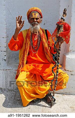 Nepal, City of Kathmandu, Pashupatinath hinduist temple, where dead people are cremated along a small river, a sadhu or holy homeless View Large Photo Image Stock Image - Nepal, City of Kathmandu, Pashupatinath hinduist temple, where dead people are cremated along a small river, a sadhu or holy homeless. Fotosearch
