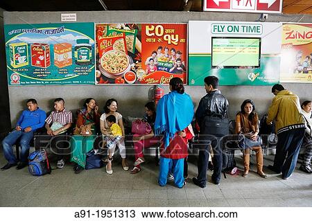 Stock Image - Nepal, City of Katmandu, the domestic airport, local passengers waiting thier plane. Fotosearch