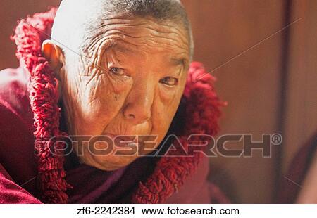 Nepal Himalayas Buddhist nun at the Kharigandentenphelling Monastery in the village of Thamo Solukhumbu Mt Everest remote religion Buddhst nunery Buddhism 90. View Large Photo Image Picture - Nepal Himalayas Buddhist nun at the Kharigandentenphelling Monastery in the village of Thamo Solukhumbu Mt Everest remote religion Buddhst nunery Buddhism 90.. Fotosearch