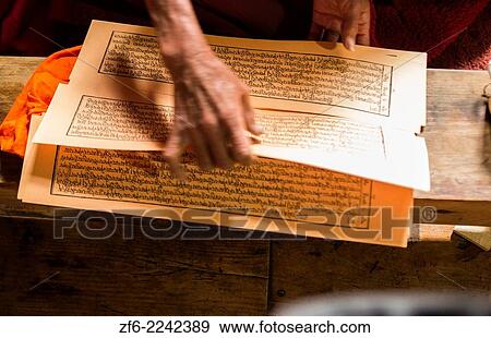 Nepal Himalayas Buddhist nun at the Kharigandentenphelling Monastery in the village of Thamo Solukhumbu close up of Tibetan Scripture Mt Everest remote religion Buddhst nunery Buddhism 83 84. View Large Photo Image Stock Photo - Nepal Himalayas Buddhist nun at the Kharigandentenphelling Monastery in the village of Thamo Solukhumbu close up of Tibetan Scripture Mt Everest remote religion Buddhst nunery Buddhism 83 84.. Fotosearch