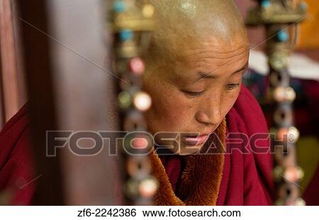 Stock Photograph - Nepal Himalayas Buddhist nun at the Kharigandentenphelling Monastery in the village of Thamo Solukhumbu Mt Everest remote religion Buddhst nunery Buddhism 90.. Fotosearch