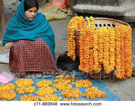 Nepal, Kathmandu, Jana Bahal temple, vendor of flower offerings View Large Photo Image Stock Photo - Nepal, Kathmandu, Jana Bahal temple, vendor of flower offerings. Fotosearch