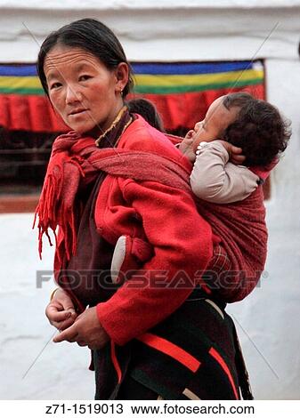 Stock Image - Nepal, Kathmandu Valley, Bodhnath, tibetan mother and child. Fotosearch