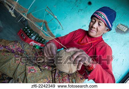 Nepal. Nepali weaving woman, posing and weaving threads for carpets. Nayapati, Eastern Kathmandu. 43. View Large Photo Image Stock Photo - Nepal. Nepali weaving woman, posing and weaving threads for carpets. Nayapati, Eastern Kathmandu. 43.. Fotosearch