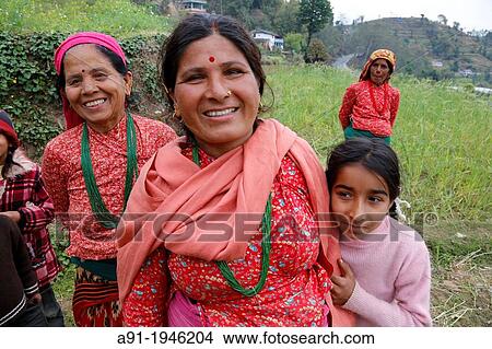 Nepal, Pokhara area, Pouderkot Village located on the Annapurna ancient way leading to Tibet and Mustang and offering beyond ricefields terraces stunning view on the Annapurna snowy Mountains, villagers View Large Photo Image Picture - Nepal, Pokhara area, Pouderkot Village located on the Annapurna ancient way leading to Tibet and Mustang and offering beyond ricefields terraces stunning view on the Annapurna snowy Mountains, villagers. Fotosearch