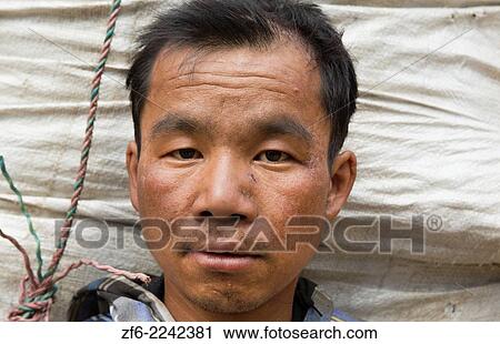 Nepal Porter poses for camera with head against basket load in Thamo, Solukhumburemote, Mt Everest, Himalayas 81. View Large Photo Image Stock Image - Nepal Porter poses for camera with head against basket load in Thamo, Solukhumburemote, Mt Everest, Himalayas 81.. Fotosearch