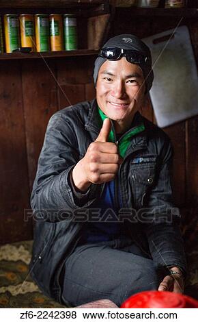 Nepal. Porter poses portrait in a Porter House in the village of Samshog Solukhumbu, remote, Mt Everest, Himalayas 98. View Large Photo Image Stock Photo - Nepal. Porter poses portrait in a Porter House in the village of Samshog Solukhumbu, remote, Mt Everest, Himalayas 98.. Fotosearch