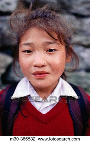 Stock Image - Nepalese girl in school uniform. Phakding, Khumbu, Nepal. Fotosearch