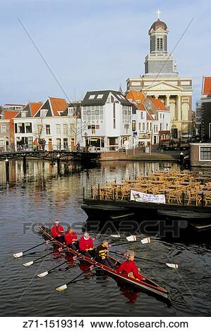 Picture - Netherlands, Leiden, canal scene, rowboat, people.. Fotosearch