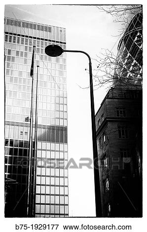 Stock Photo - new architecture with Gherkin building designed by Foster and Partners on the background, London, England, UK. Fotosearch